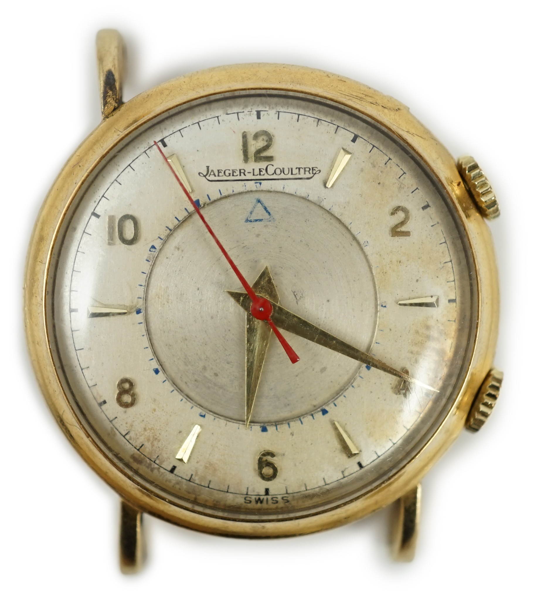 A gentleman's 9ct gold Jaeger LeCoultre memovox wrist watch, with case back inscription and lacking one lug, case diameter 32mm, gross weight 26.4 grams.